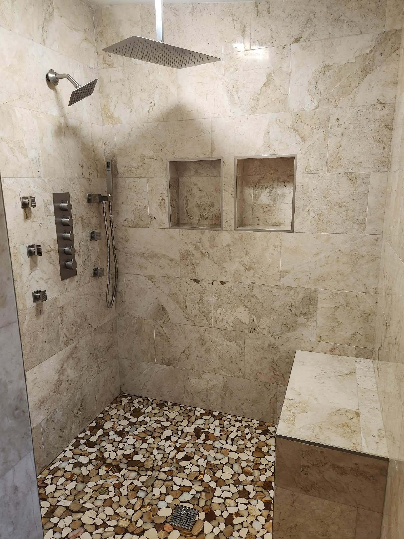 Custom Tile Shower — Marble Walls & Pebble Stone Floor