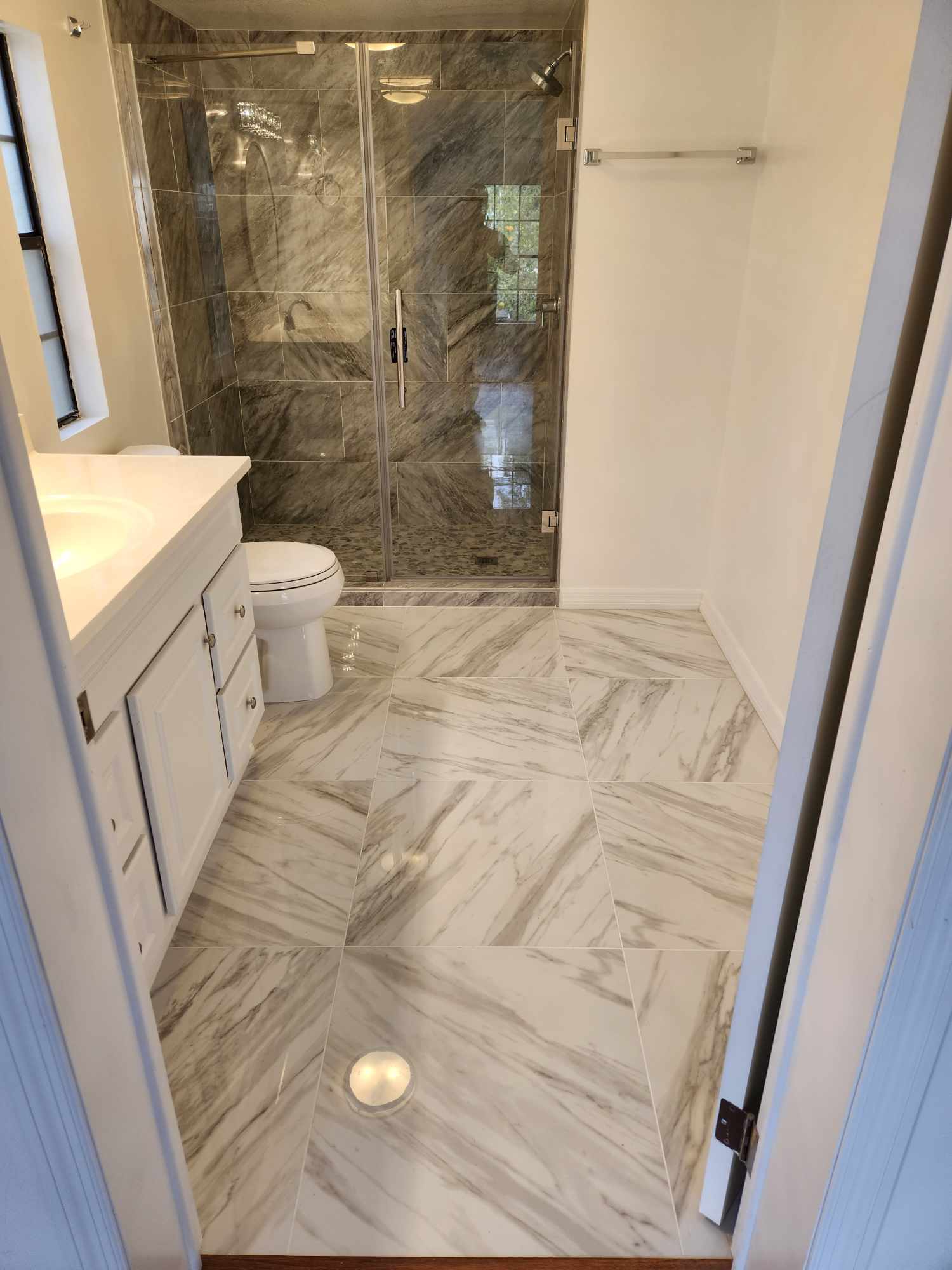 Custom Floor Tile — Herringbone Marble with Matching Shower