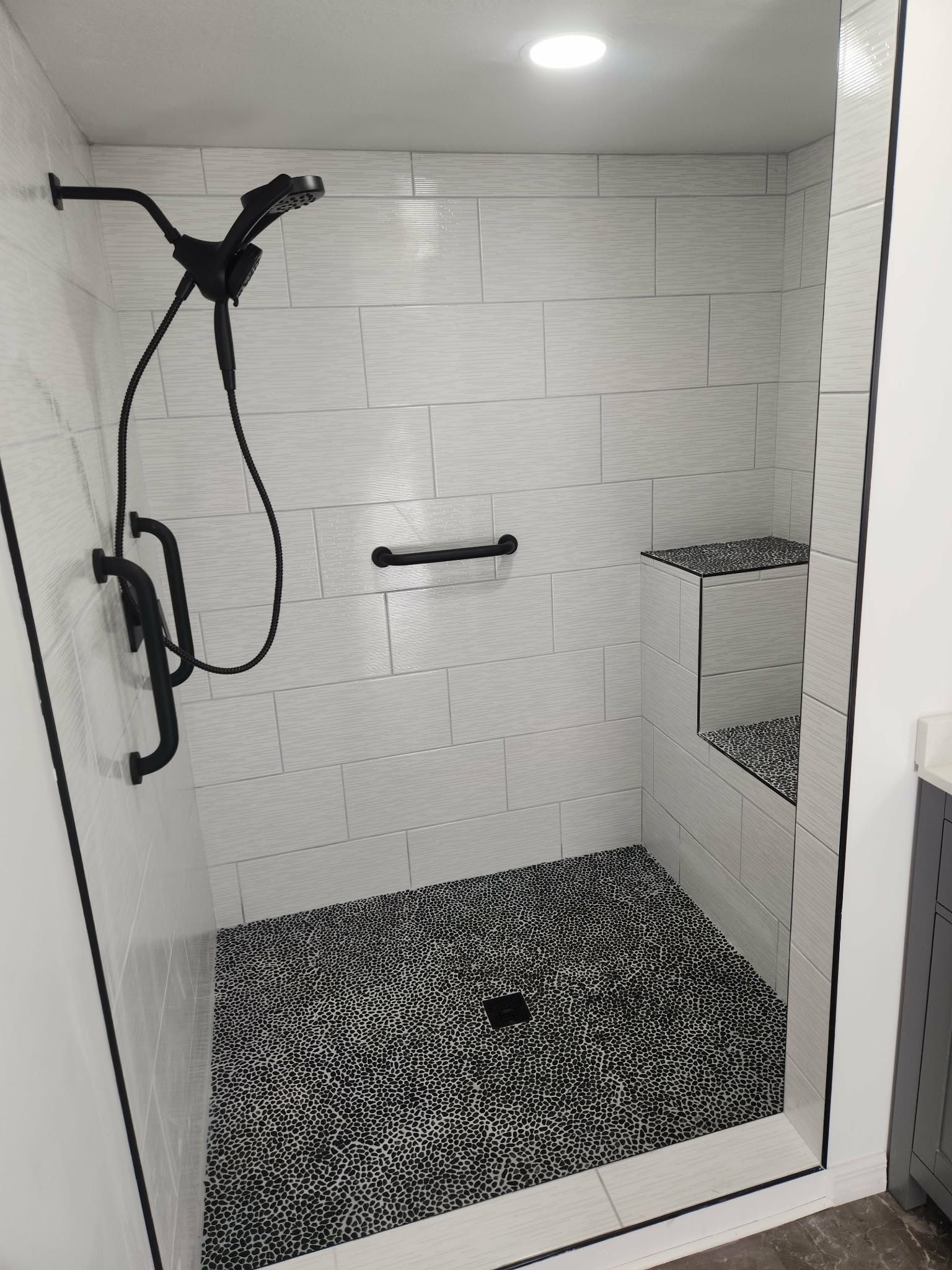 Shower Tile Installation — Large Format Tile & Pebble Stone Floor